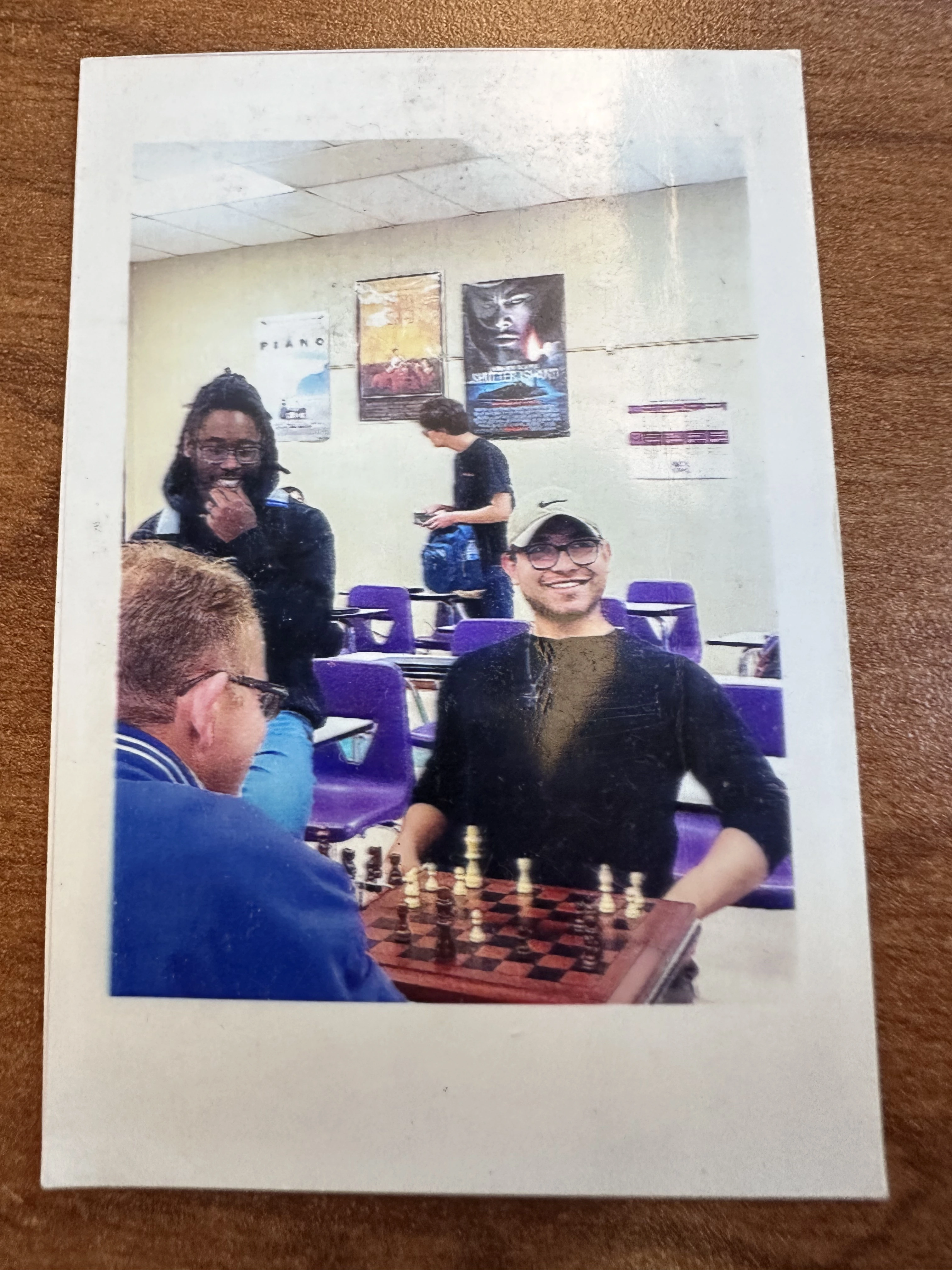 personal photo of me playing chess during the last day of highschool